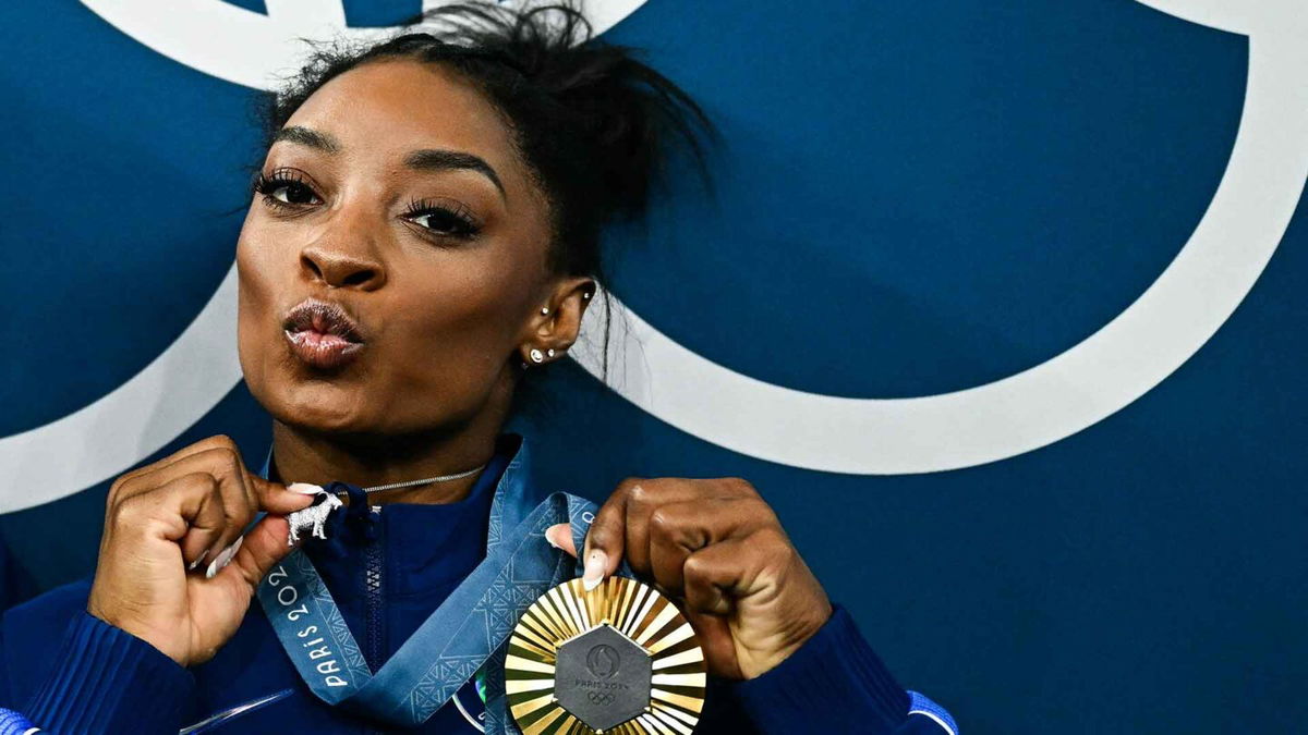 Simone Biles wears goat necklace