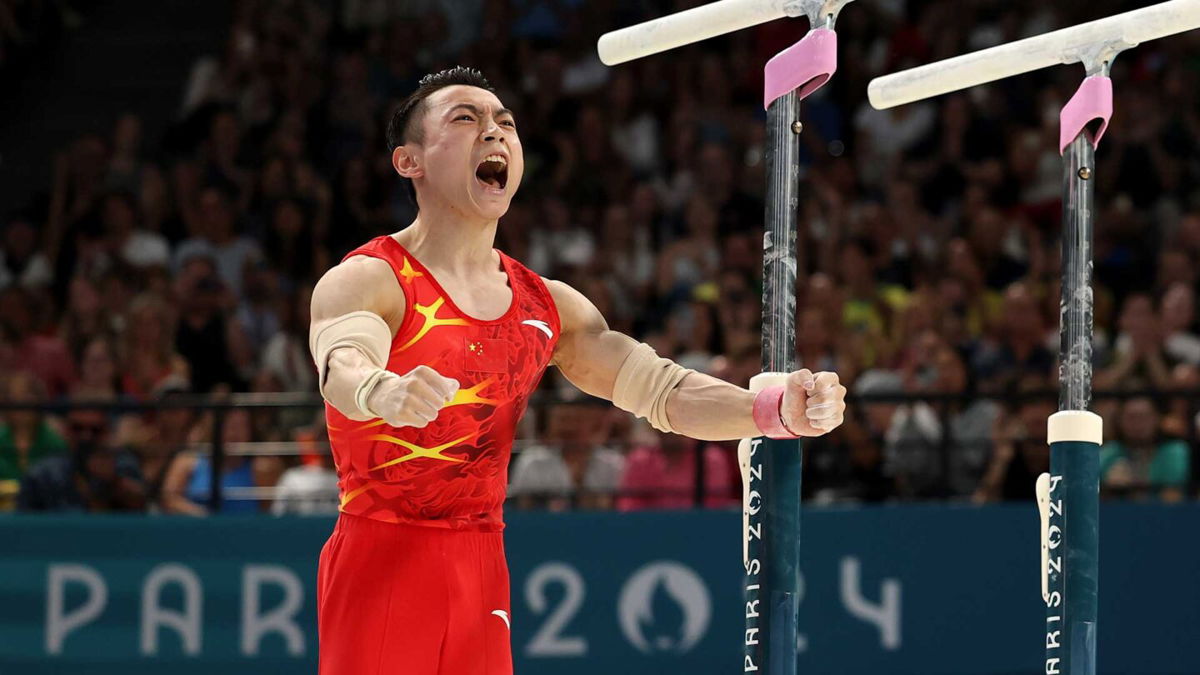 Zou Jingyuan celebrates after nailing his parallel bar routine to win the gold medal at the 2024 Paris Olympics.