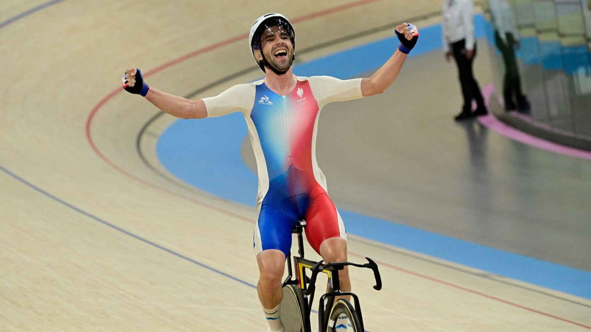 Benjamin Thomas celebrates winning the men's omnium race.