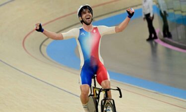 Benjamin Thomas celebrates winning the men's omnium race.