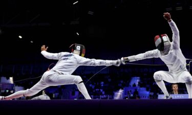 Marvin Dogue and Csaba Bohm compete in fencing during the modern pentathlon.