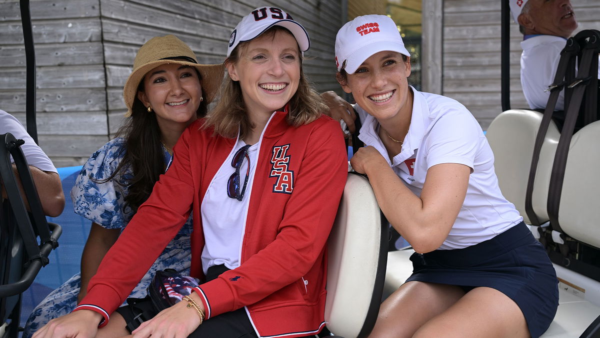 Katie Ledecky watches 'land sport' and good friend Albane Valenzuela at