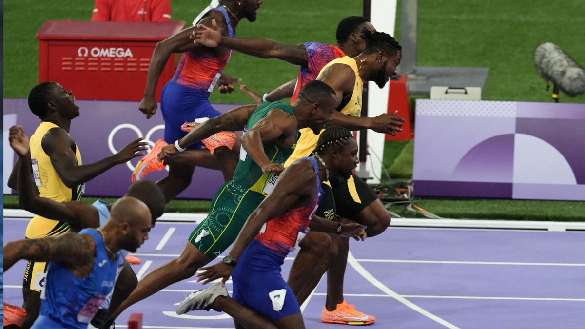 Noah Lyles wins first Olympic title, takes 100m gold in epic photo ...