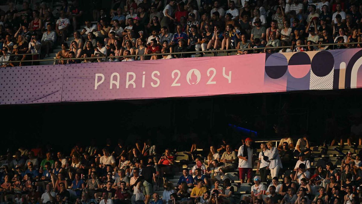 Fans fill the stands at Stade de France during rugby matches.