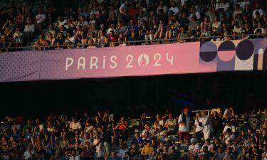 Fans fill the stands at Stade de France during rugby matches.