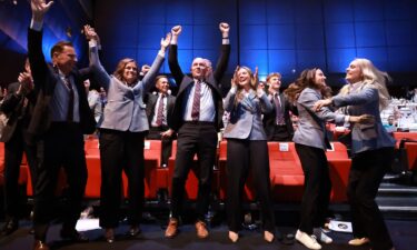 Members of the Utah 2034 delegation celebrate as Salt Lake City