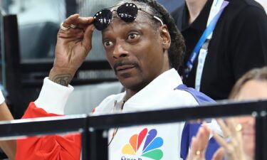 Snoop Dogg attends the United States' women's gymnastics qualifying session at the 2024 Paris Olympics.