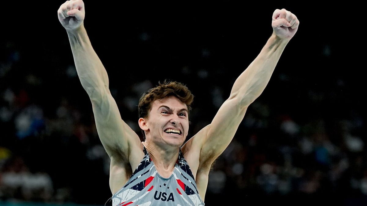 Stephen Nedoroscik celebrates with his U.S. gymnastics teammates after his pommel horse performance clinched the team's first Olympic medal since 2008.