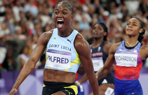 Julien Alfred of Saint Lucia crosses the finish line during the women's 100m final at Stade de France.