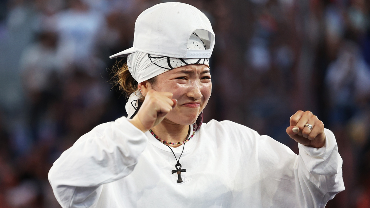 B-Girl Ami of Japan reacts to her victory in the first-ever Olympic breaking event.