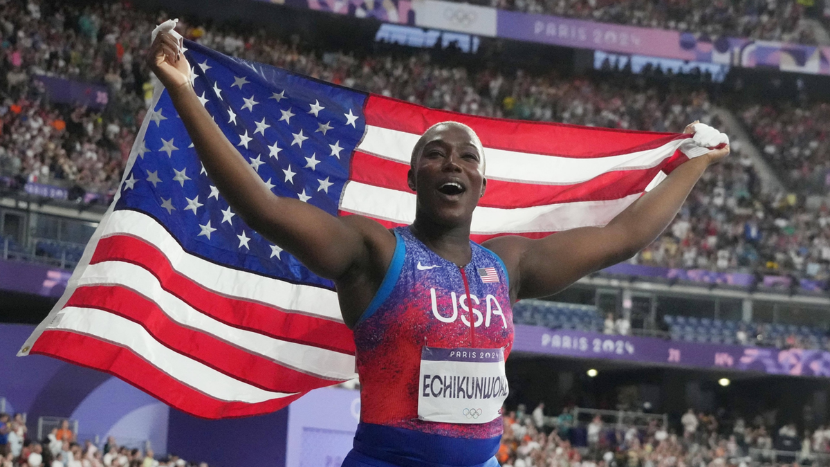 Annette Echikunwoke celebrates her silver medal in the women's hammer throw during the Paris Games at Stade de France.