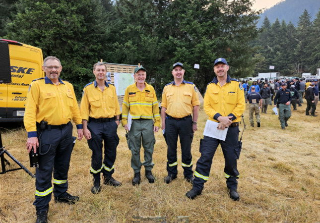 Australian firefighters meet for morning briefing for the Coffee Pot Fire located on the Willamette National Forest.