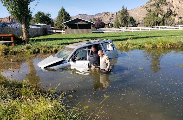 Bend man arrested for DUI and reckless driving after SUV crashes and lands in pond near Smith Rock