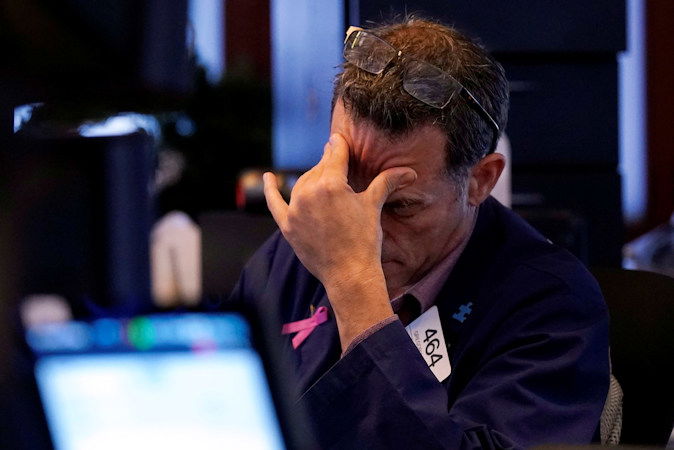 Trader Gregory Rowe works on the floor of the New York Stock Exchange, Monday, Aug. 5, 2024.