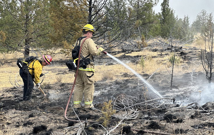 Big progress has been made on stopping the Elk Lane Fire west of Madras, but fire crews still have plenty of work to do.