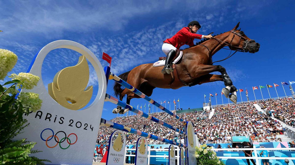 Karl Cook and horse Caracole De La Roque of Team United States compete in the Jumping Individual Final in Versailles