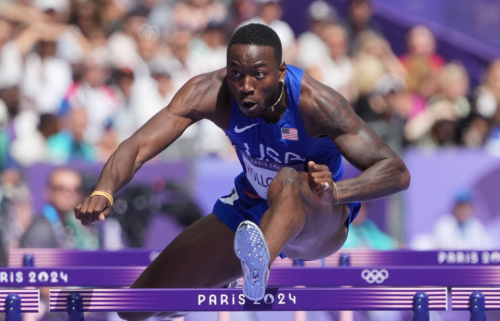 Grant Holloway competes in men's 110m hurdles during the Paris Olympic Games at Stade de France.