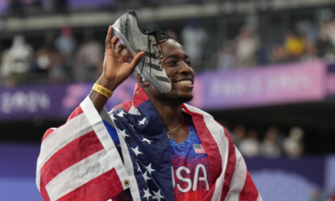 Grant Holloway celebrates after winning the men's 110m hurdles final during the Paris Olympic Games at Stade de France.