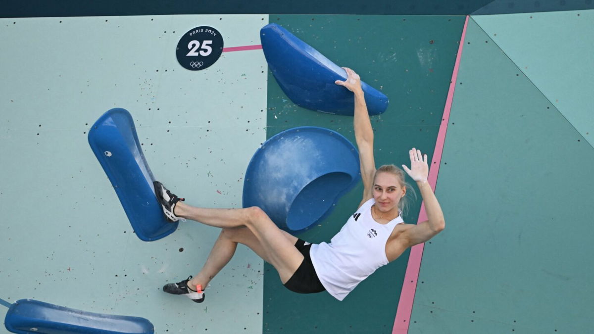 Janja Garnbret celebrates topping a boulder