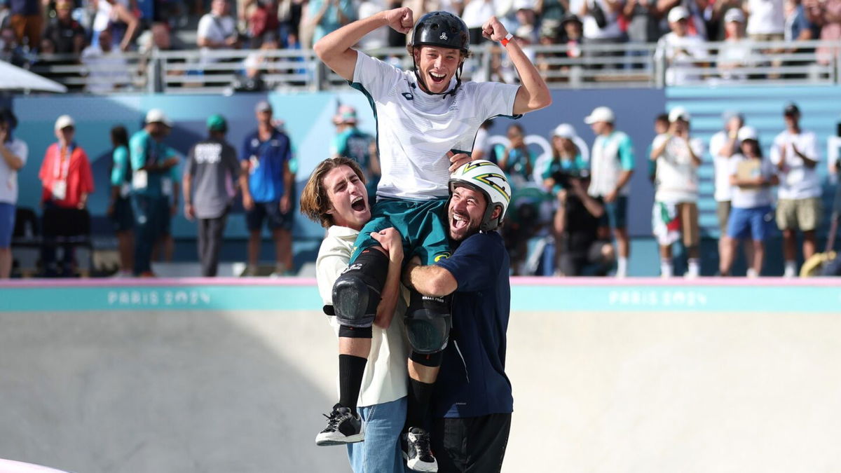 Keegan Palmer is lifted on the shoulders of Tate Carew and Pedro Barros