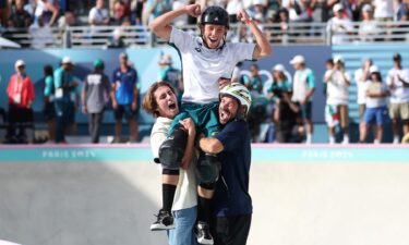 Keegan Palmer is lifted on the shoulders of Tate Carew and Pedro Barros