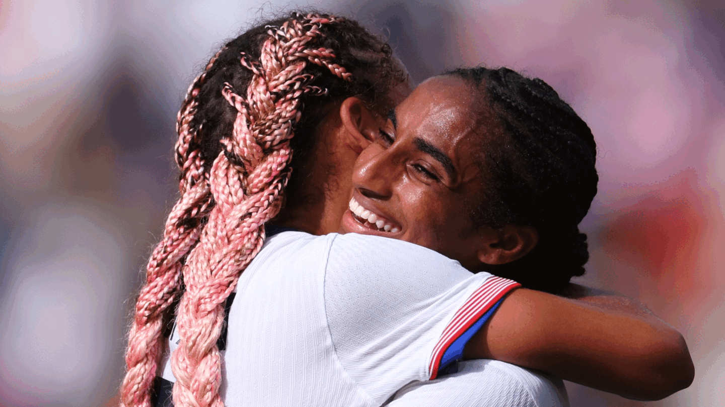 Trinity Rodman and Naomi Girma embrace after the USWNT defeated Japan at the Olympics