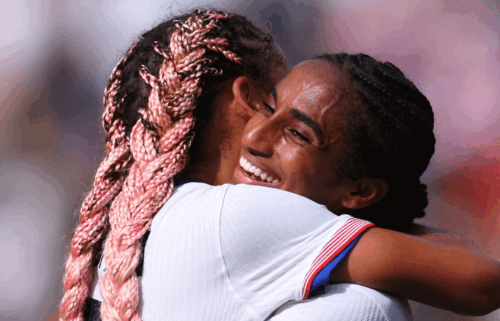 Trinity Rodman and Naomi Girma embrace after the USWNT defeated Japan at the Olympics