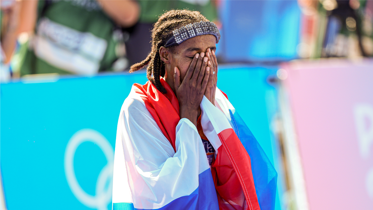 Sifan Hassan of The Netherlands celebrates after winning gold in the women's marathon at the Paris Olympic Games.