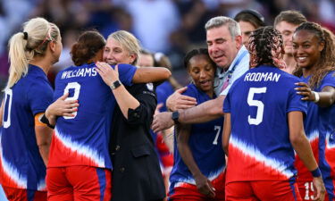 Emma Hayes and Lynn Williams embrace following the USWNT's 1-0 win over Brazil in the gold medal match