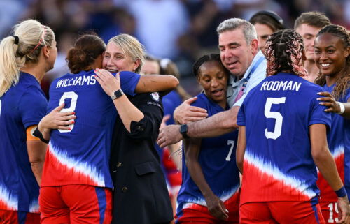 Emma Hayes and Lynn Williams embrace following the USWNT's 1-0 win over Brazil in the gold medal match