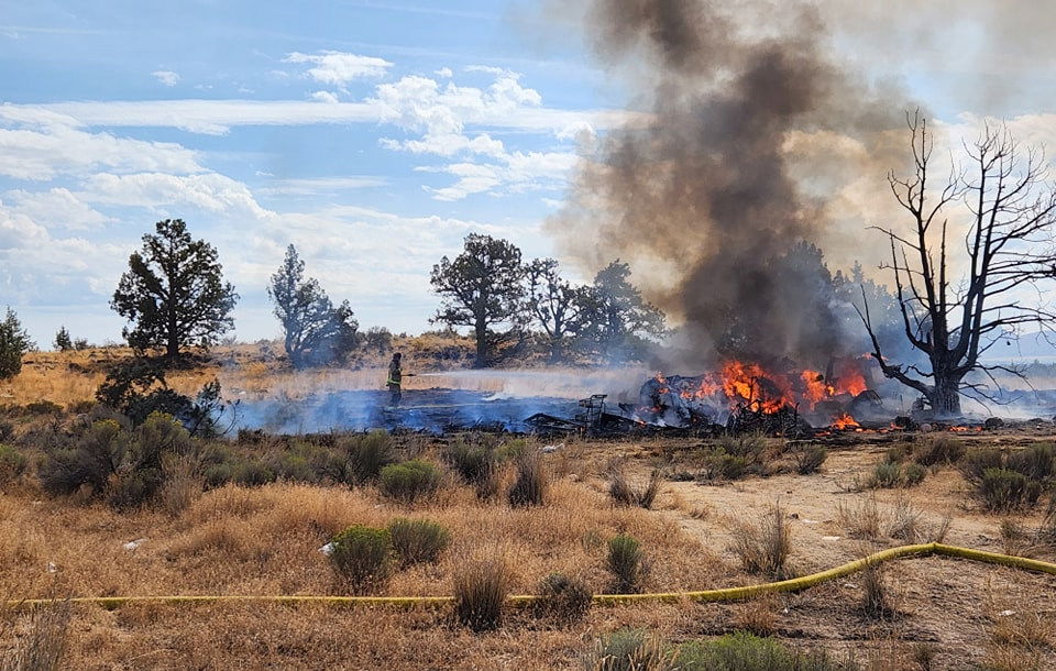 RV fire spreads to half an acre of brush and trees off Highway 126 in Redmond; vape pen charging apparent cause