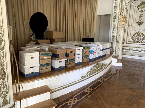 This photo from the US Justice Department shows what the Justice Department says are boxes of documents stored on the stage of the White and Gold Ballroom at Trump's Mar-a-Lago club in Florida in early 2021.