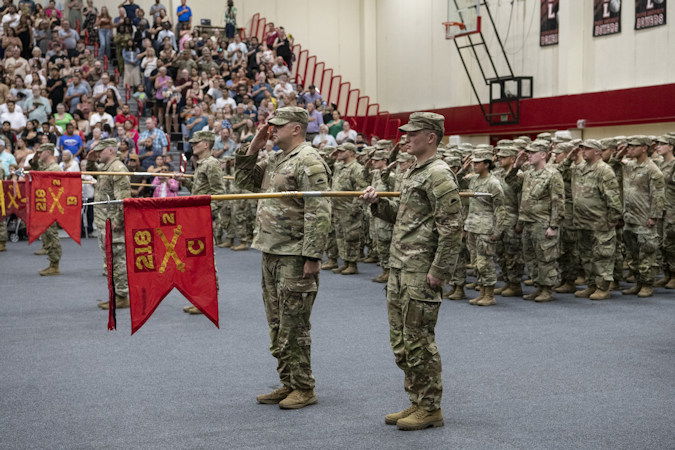 Oregon Army National Soldiers assigned to 2nd Battalion, 218th Field Artillery Regiment render a hand salute during their mobilization ceremony held in their honor at Pacific University in Forest Grove on Friday.