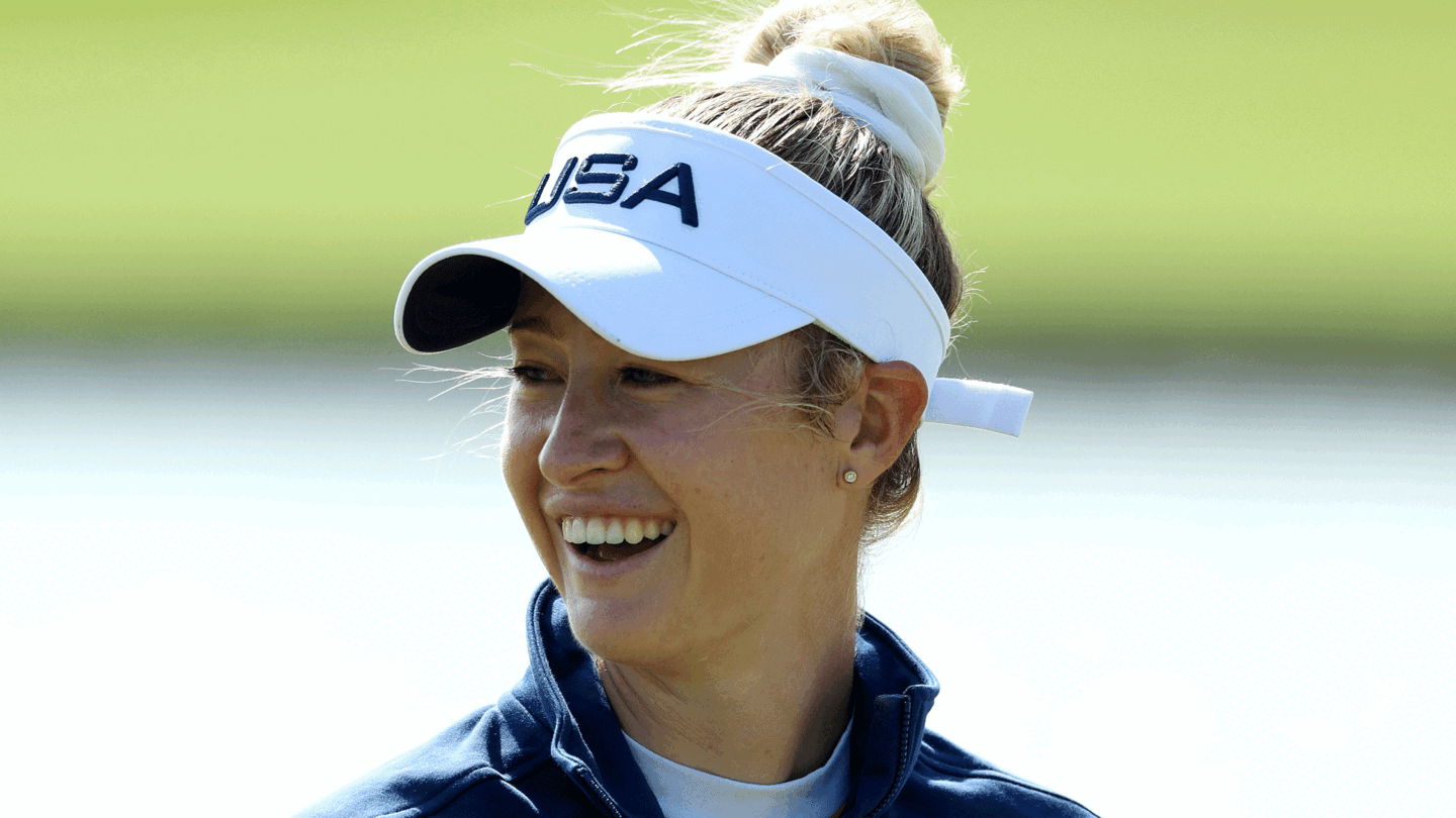 Nelly Korda smiles underneath a white visor at Day 1 of women's golf at the 2024 Paris Olympics