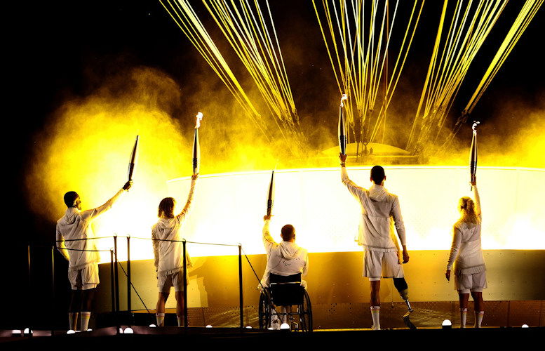 Athletes Charles-Antoine Kouakou, Nantenin Keïta, Fabien Lamirault, Alexis Hanquinquant and Élodie Lorandi lit the Olympic cauldron.