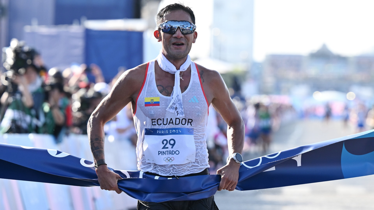 Brian Pintado from Ecuador crosses the finish line as the winner in the men's 20km race walk.