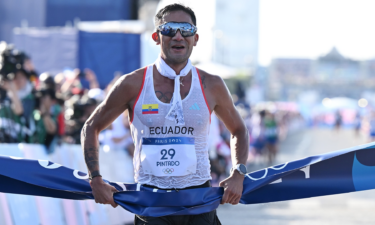 Brian Pintado from Ecuador crosses the finish line as the winner in the men's 20km race walk.