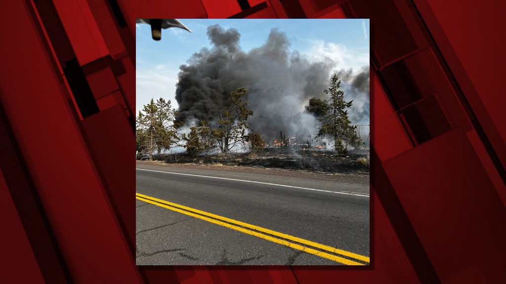 Deputies say sparks from a dragged tire on Hwy. 126 sparked a fire Friday evening that destroyed structures, prompted evacuations