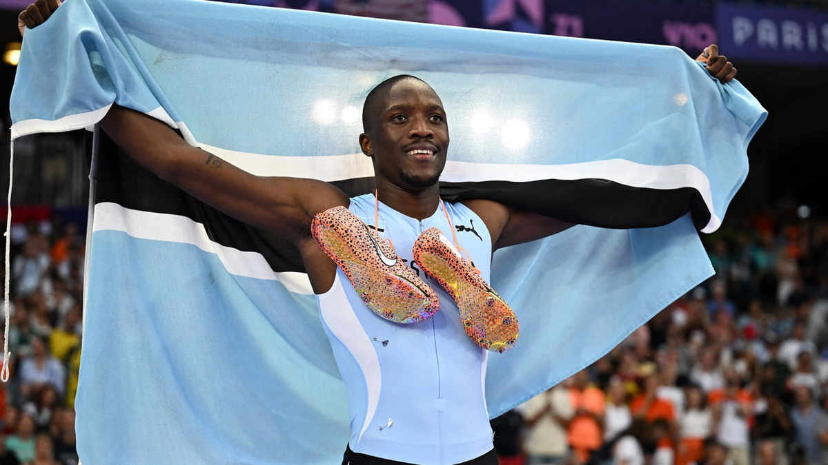 Botswana's Letsile Tebogo crosses the finish line ahead of Kenny Bednarek and Noah Lyles to win the men's 200m final at the Paris Olympics.