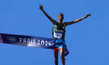 Tamirat Tola of Ethiopia celebrates after the men's marathon at the Paris Olympics