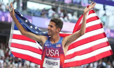 Grant Fisher with American flag