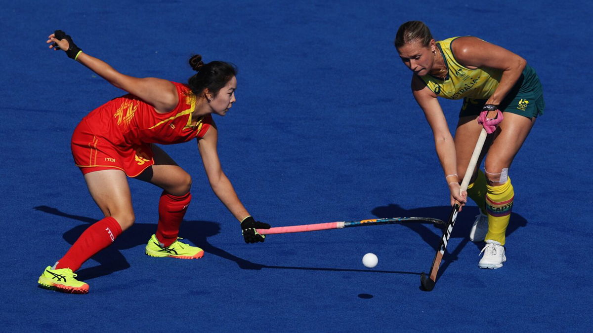 Kaitlin Nobbs of Australia is challenged by Jinzhuang Tan of China during a women's quarterfinal match on day ten of the 2024 Paris Olympics at Stade Yves Du Manoir on August 05