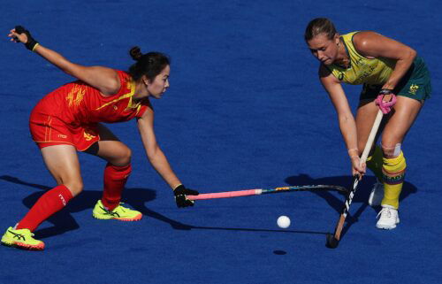 Kaitlin Nobbs of Australia is challenged by Jinzhuang Tan of China during a women's quarterfinal match on day ten of the 2024 Paris Olympics at Stade Yves Du Manoir on August 05