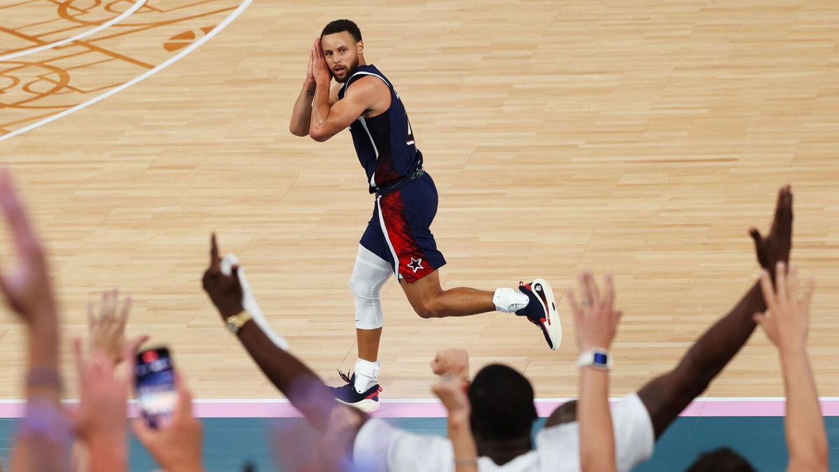 Stephen Curry of the United States reacts after a three point basket during the Men's Gold Medal game between France and the United States