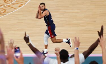 Stephen Curry of the United States reacts after a three point basket during the Men's Gold Medal game between France and the United States