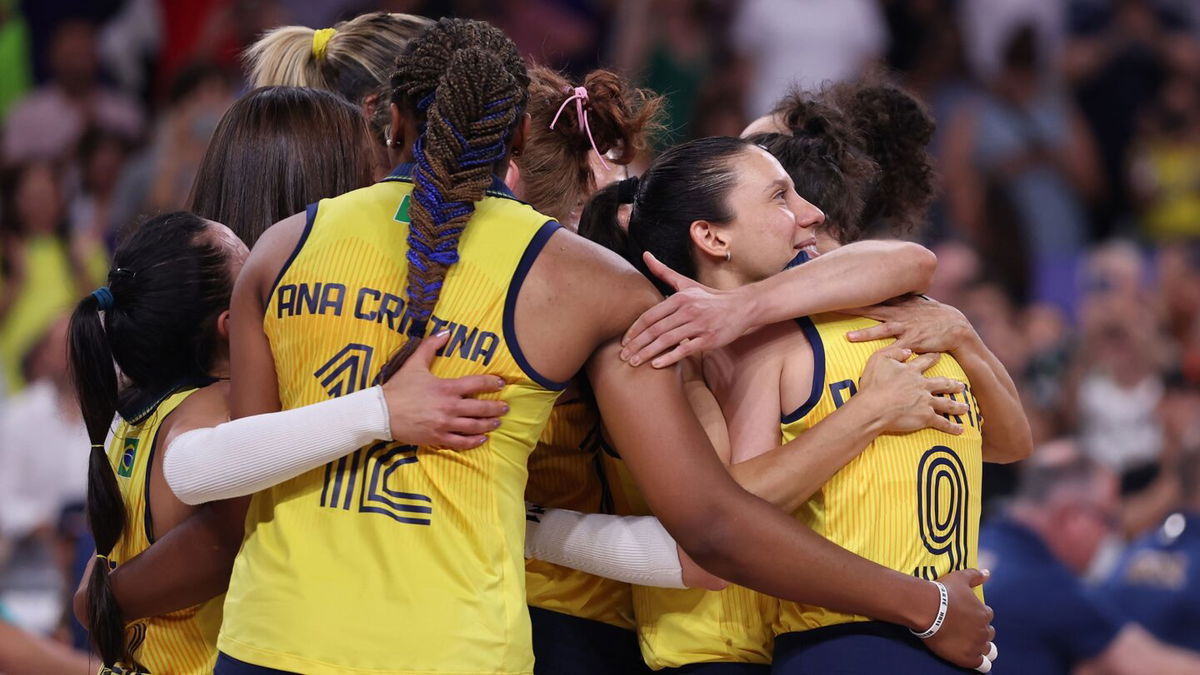 Members of Brazil celebrate after defeating Turkiye during the Women's volleyball Bronze Medal match