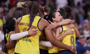 Members of Brazil celebrate after defeating Turkiye during the Women's volleyball Bronze Medal match