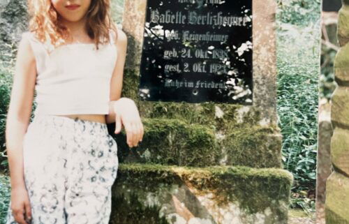 American Erin Levi stands next to the grave of her grandfather's grandmother