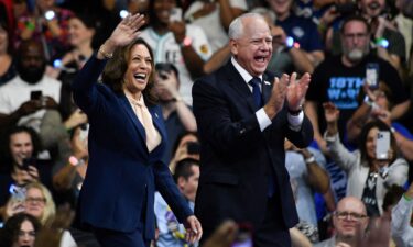 Vice President Kamala Harris and Minnesota Gov. Tim Walz greet supporters as they arrive at a rally in Philadelphia on August 6