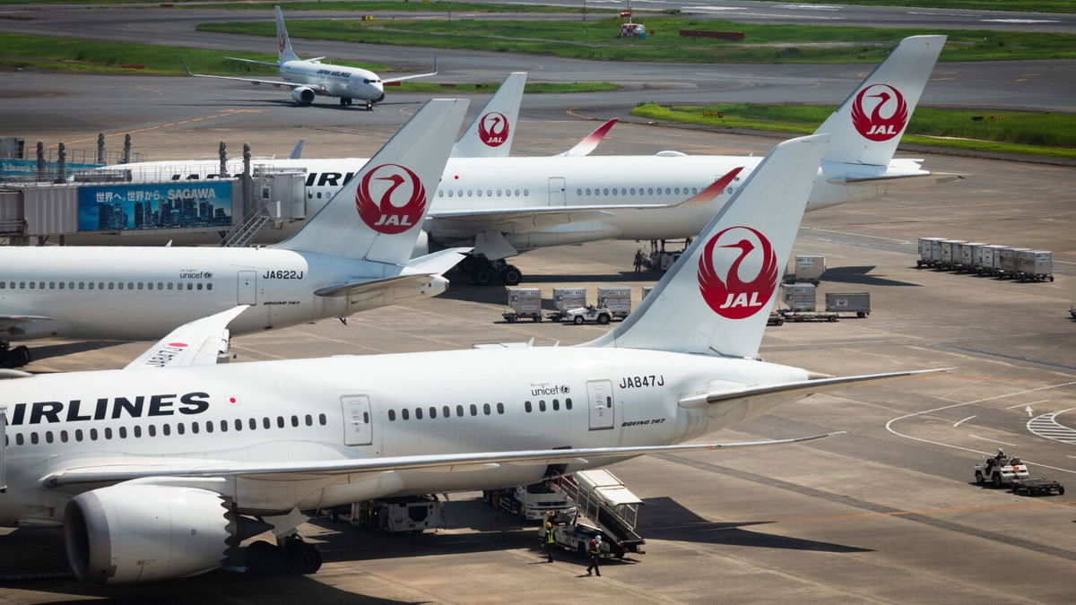 <i>Kentaro Takahashi/Bloomberg/Getty Images via CNN Newsource</i><br/>Japan Airlines planes at Haneda Airport in Tokyo on August 10.